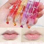 Fruit lip oil collection showcasing vibrant glosses with before and after lip results for hydration and shine.