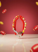 Handmade bead bracelets in vibrant colors with letter beads and football charm, perfect for game day.