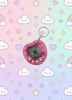 Mini electronic fidget keychain toy on a colorful pastel cloud background.