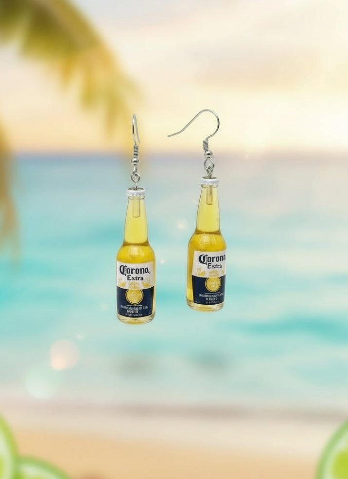 Beer bottle-shaped earrings on a display card with a white background