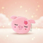Kawaii pig plush coin purse keychain with cute face and flower design on a soft background.