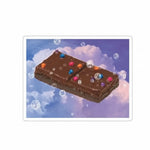 Cosmic brownie space sticker featuring a brownie floating in clouds with colorful sprinkles and bubbles.