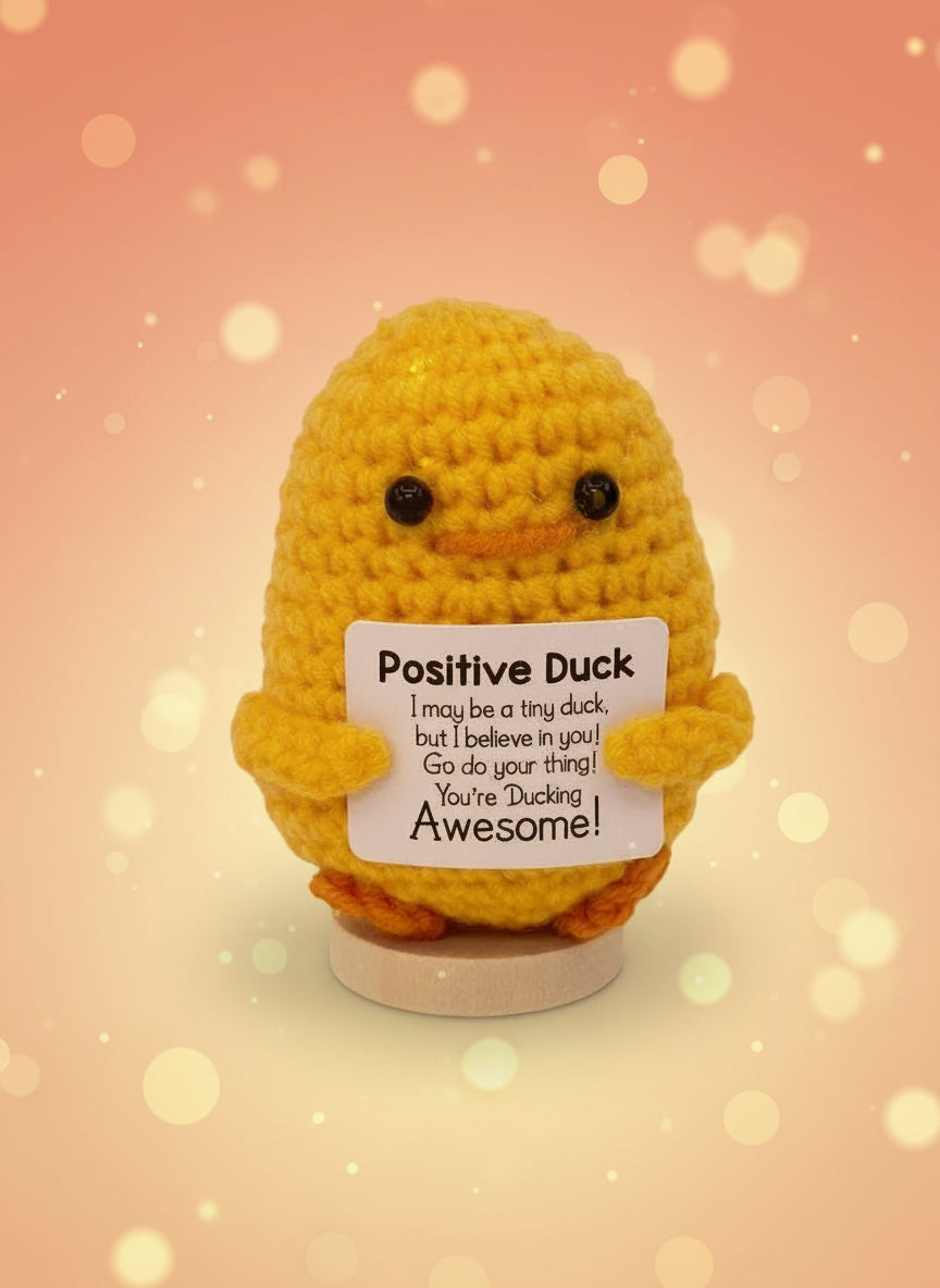 Emotional support duck plushie with a sign reading 'You're Ducking Awesome!' for encouragement and joy.