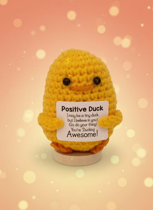 Emotional support duck plushie with a sign reading 'You're Ducking Awesome!' for encouragement and joy.