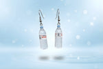 Mini water bottle earrings featuring playful dangle design, perfect quirky accessory for hydration enthusiasts.