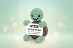 Emotional Support Turtle holding a sign that says 'SISTER I turtle-y love you', a handmade crochet plush by Craft-N-Crumble™.