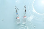 Mini water bottle earrings with Evian charm, fun dangle earrings for hydration fans and quirky accessory lovers.
