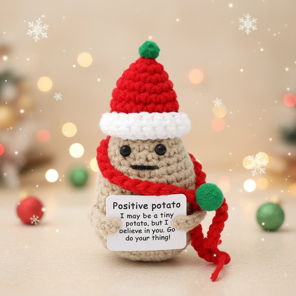 Emotional support crochet christmas potato with wooden stand wearing a red scarf and hat, holding a sign.