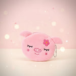Kawaii pig plush coin purse keychain in soft pink with flower embroidery, perfect mini zipper pouch for essentials.
