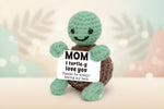 Emotional Support Turtle holding a sign saying 'MOM I turtle-y love you Thanks for always having my back'.