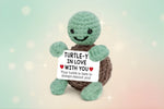 Emotional Support Turtle holding a sign that says 'TURTLE-Y IN LOVE WITH YOU' by Craft-N-Crumble™.