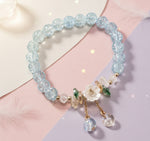 Floral crystal beaded bracelet featuring blue crystal beads and floral accents, perfect for vintage-inspired styling.