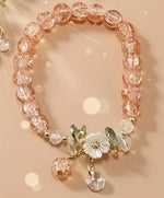 Floral crystal beaded bracelet featuring pink crystal beads and floral accents, perfect for vintage-inspired jewelry lovers.