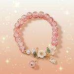 Floral crystal beaded bracelet featuring pink beads and floral accents for a vintage-inspired look.