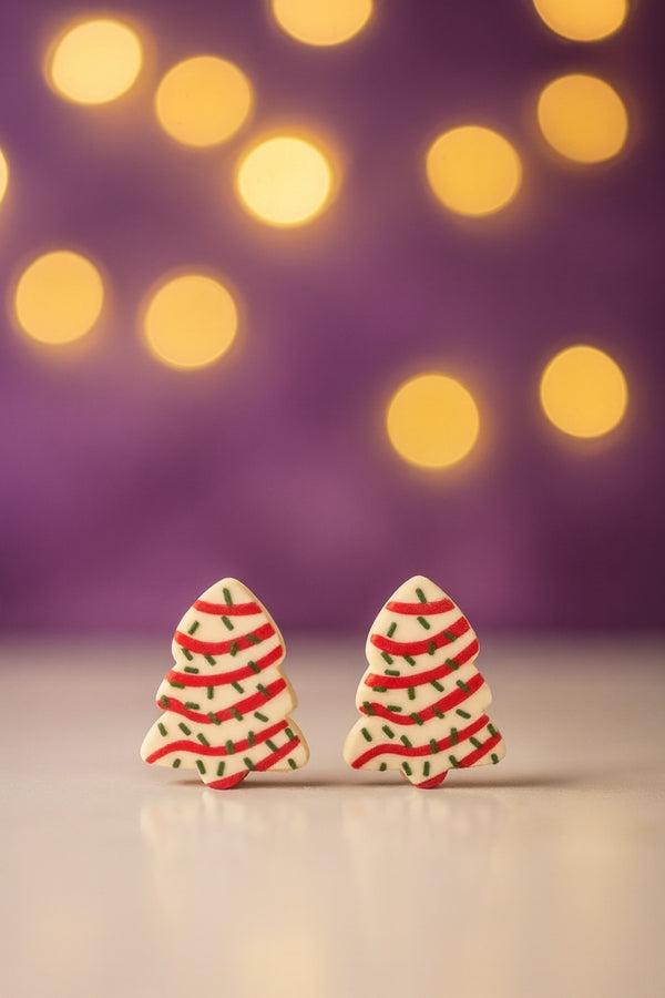 Festive Tree Dessert Earrings displayed with soft bokeh lights in the background, perfect holiday jewelry.