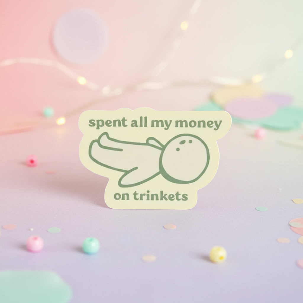 spent all my money on trinkets sticker featuring a cute design of a character lying down with pastel background