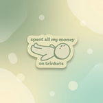 spent all my money on trinkets sticker with a cute character illustration on a soft background.