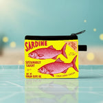 Vintage sardine coin purse featuring bright yellow label with fish design, perfect retro zipper pouch for small essentials.