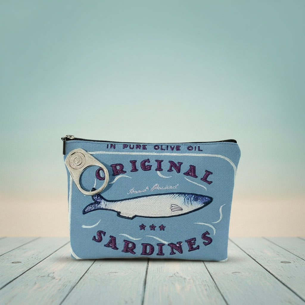 Vintage sardines makeup bag featuring blue design with fish and zipper closure, perfect for organizing cosmetics.