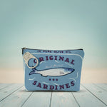 Vintage sardines makeup bag featuring blue design with fish and zipper closure, perfect for organizing cosmetics.