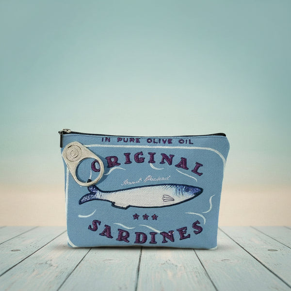 Vintage sardines makeup bag featuring blue design with fish and zipper closure, perfect for organizing cosmetics.