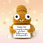 Positive Poo Crochet Doll with Wooden Stand holding an encouraging sign, perfect for desk decor.