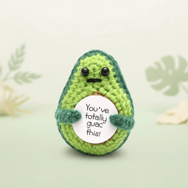 Positive Avocado Crochet Plush with Wooden Stand holding a sign that says 'You’ve Totally Guac This'.