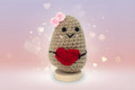 Emotional support potato plushie with a heart, handmade from soft yarn, perfect for comfort and positivity.