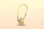 Miniature doll cell phone in yellow with playful designs, perfect for monster dolls and dioramas by Craft-N-Crumble®.