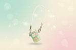 Miniature doll cell phone for monster dolls by Craft-N-Crumble®, featuring colorful buttons and a charm strap.