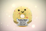 Emotional support donut crochet ornament with a cheerful face and motivational message for encouragement.