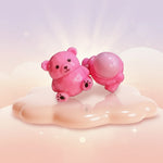 Handmade Bear Lip Balm in a cute bear shape with a color-change tint, displayed on a glossy surface.