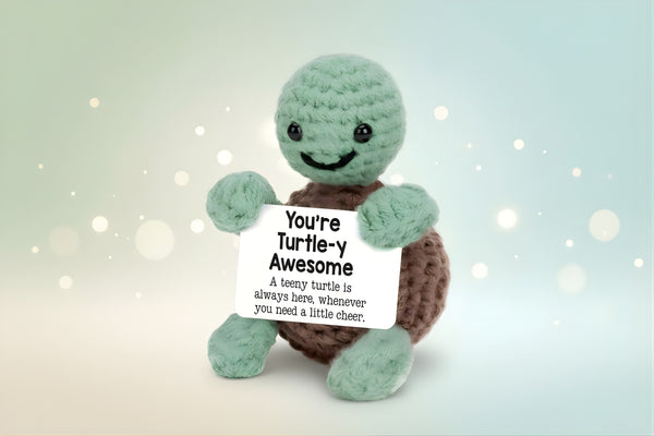 Emotional Support Turtle holding a sign that says 'You're Turtle-y Awesome', symbolizing comfort and cheer.