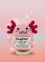 Emotional Support Axolotl by Craft-N-Crumble holding a sign saying 'Daughter I LOVE YOU AXOLOTL'.