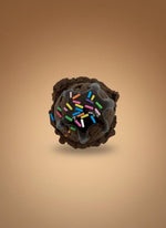 Realistic Fake Ice Cream Magnet featuring a chocolate dessert ball with colorful sprinkles on a smooth background.