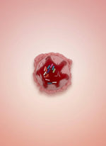 Realistic Fake Ice Cream Magnet in cherry flavor with colorful sprinkles on a pink background.