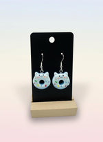 Cute Animal Donut Earrings featuring adorable cat designs with blue icing and colorful sprinkles on display.