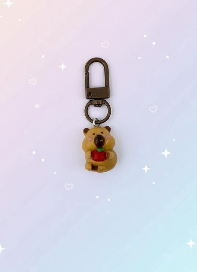 Keychain with bear design in clear packaging on a white background