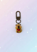 Keychain with bear design in clear packaging on a white background