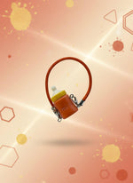 Red hair clip with a clear plastic bag on a gray background