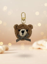 Crocheted bear keychain with a bow