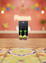 Pair of earrings on a black card with a white background