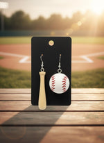 Baseball and bat earrings on a black card with a white background
