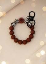 Silicone Wristlet Keychain featuring colorful beads and a floral charm for stylish key storage