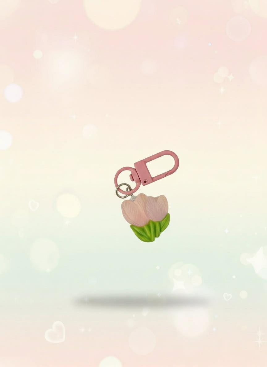 Pink keychain with a small bag on a clear plastic card, attached to a red tag with 'Sweetie' text.