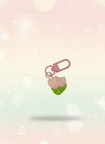 Pink keychain with a small bag on a clear plastic card, attached to a red tag with 'Sweetie' text.