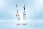 Mini water bottle earrings featuring playful dangle design, perfect quirky accessory for hydration enthusiasts.