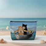 Funny cat makeup bag featuring two cats in a boat with a CATANIC design, perfect for travel and humor lovers.