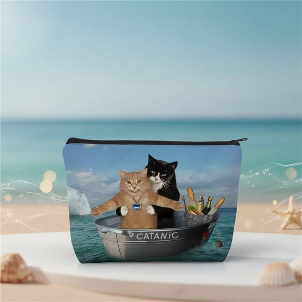 Funny cat makeup bag featuring two cats in a boat with a CATANIC design, perfect for travel and humor lovers.