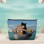 Funny cat makeup bag featuring two cats in a boat with the CATANIC design, perfect for travel enthusiasts.